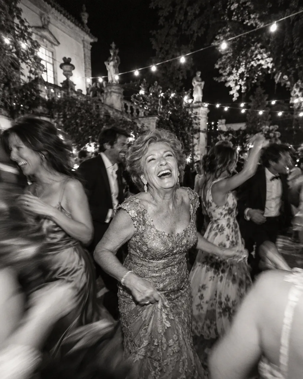Guests dancing with motion blur in black and white