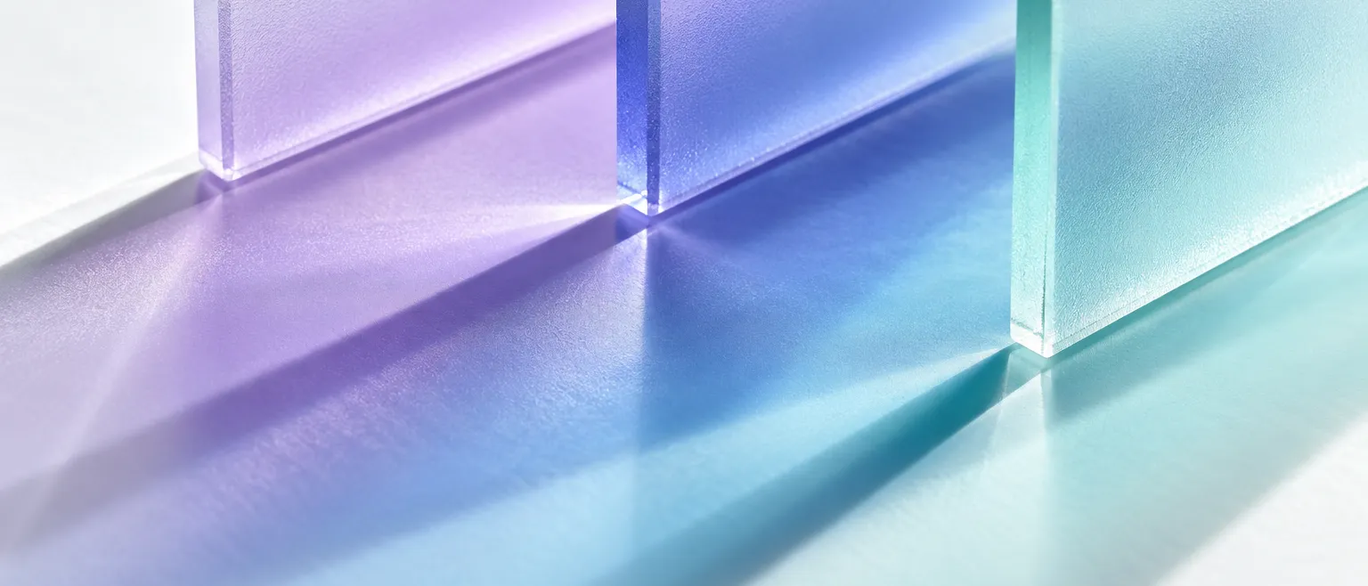 Abstract macro photograph of light passing through layered frosted glass panels, creating soft overlapping bands of…